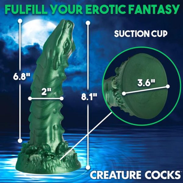 Plongez dans le Monde Envoûtant du gode Cockness Monster Le gode Cockness Monster est un chef-d'œuvre iridescent en forme de dragon.
