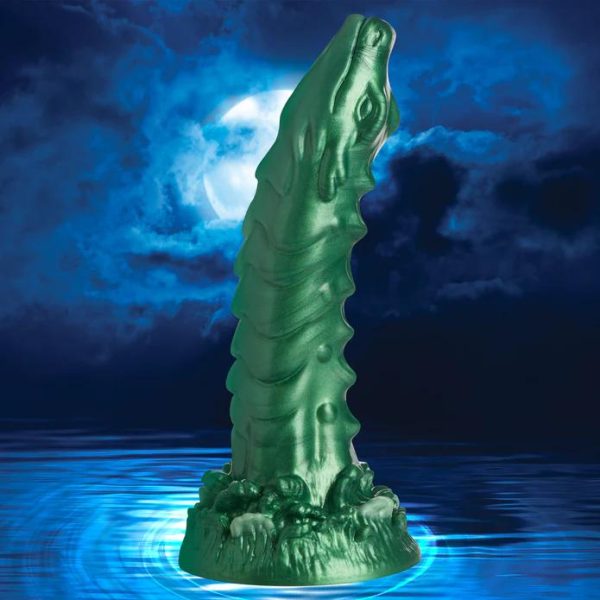 Plongez dans le Monde Envoûtant du gode Cockness Monster Le gode Cockness Monster est un chef-d'œuvre iridescent en forme de dragon.