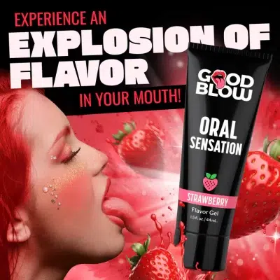 Ambiance romantique : bougies, serviettes et Gel Oral Sensation posé à côté.