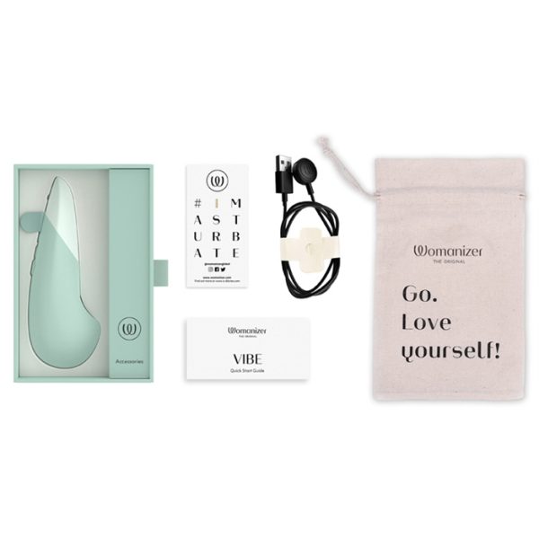 Emballage élégant du Womanizer Vibe avec accessoires inclus.