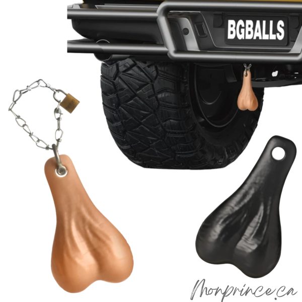 Big Truck Nuts beige en forme de testicules fixés à une remorque.