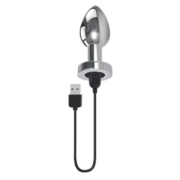 Plug vibrant en métal sur une surface lisse