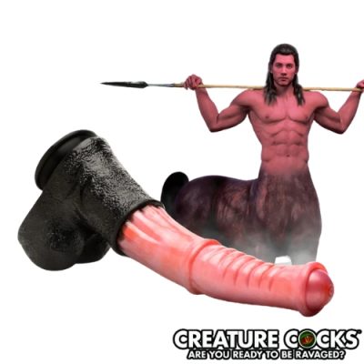 « Gode Centaure Géant en silicone pêche et noir sur fond blanc ».