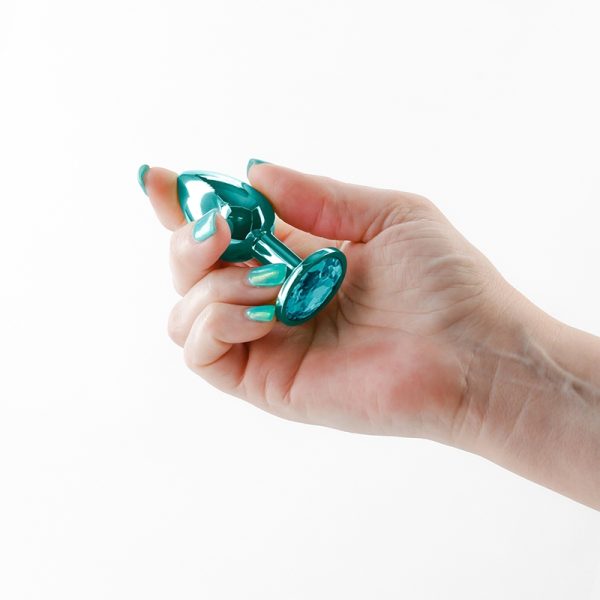 « Gros plan sur la finition miroir chromée du Rear Assets Small sarcelle ».