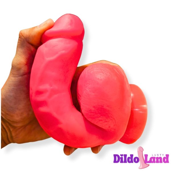 GigaGlow dildo rose fluo avec testicules réalistes
