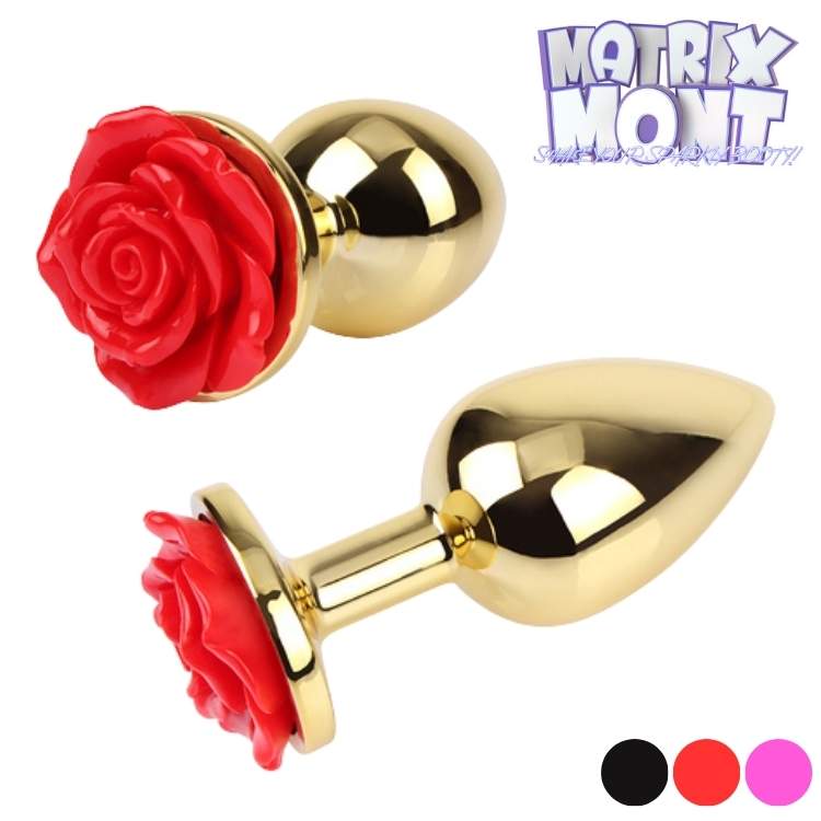 Plug anal or jaune Matrix Mont avec base en forme de rose rouge.