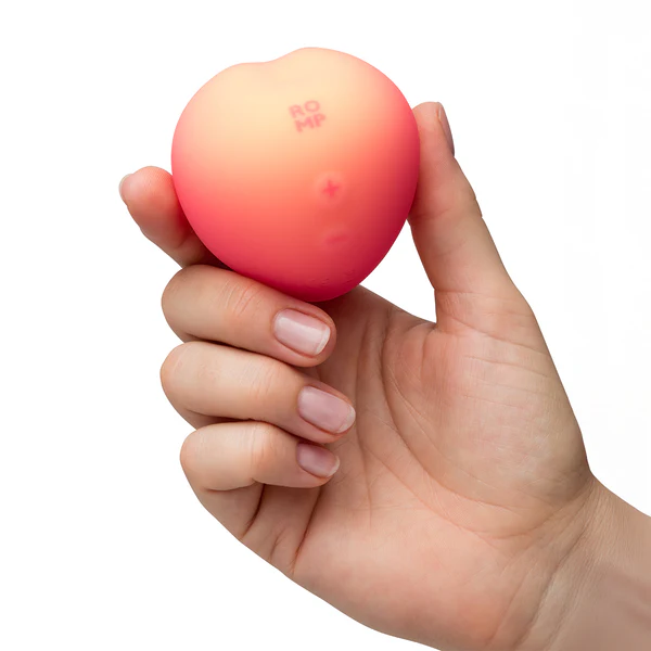 Port USB caché dans les feuilles du stimulateur ROMP Pink Peach